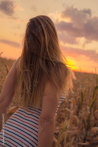 woman in the fields on sunset. Travel concept