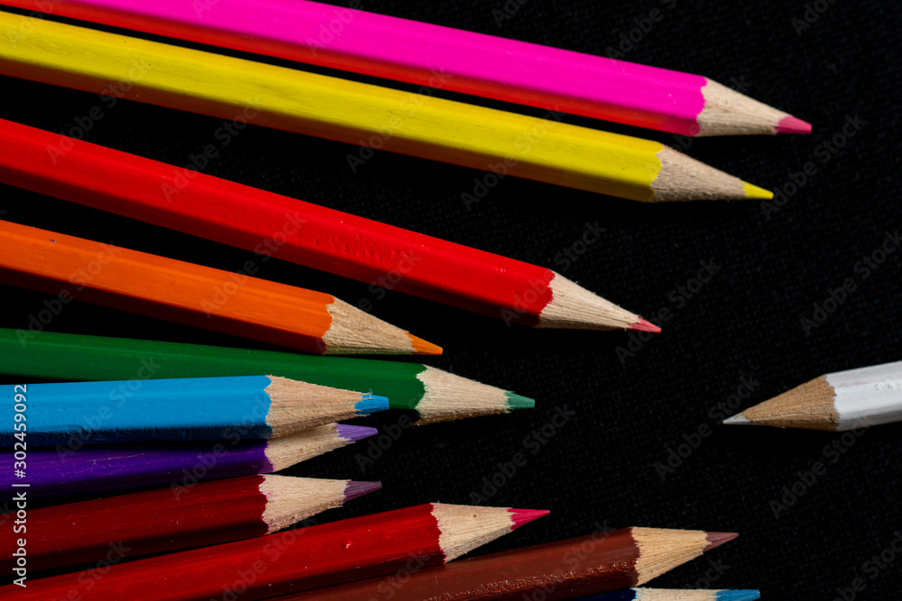 Coloured pencils isolated on black background close up. Vintage look Macro photography. Pencils Wallpaper. Bundle of rainbow colored pencils with selected focus on tips. Multicolored rainbow pencils. Coloured pencils isolated on black background close up. Vintage look Macro photography. Pencils Wallpaper. Bundle of rainbow colored pencils with selected focus on tips. Multicolored rainbow pencils.