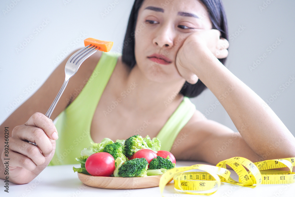 Slim women are bored of eating salad every day Slim women are bored of eating salad every day