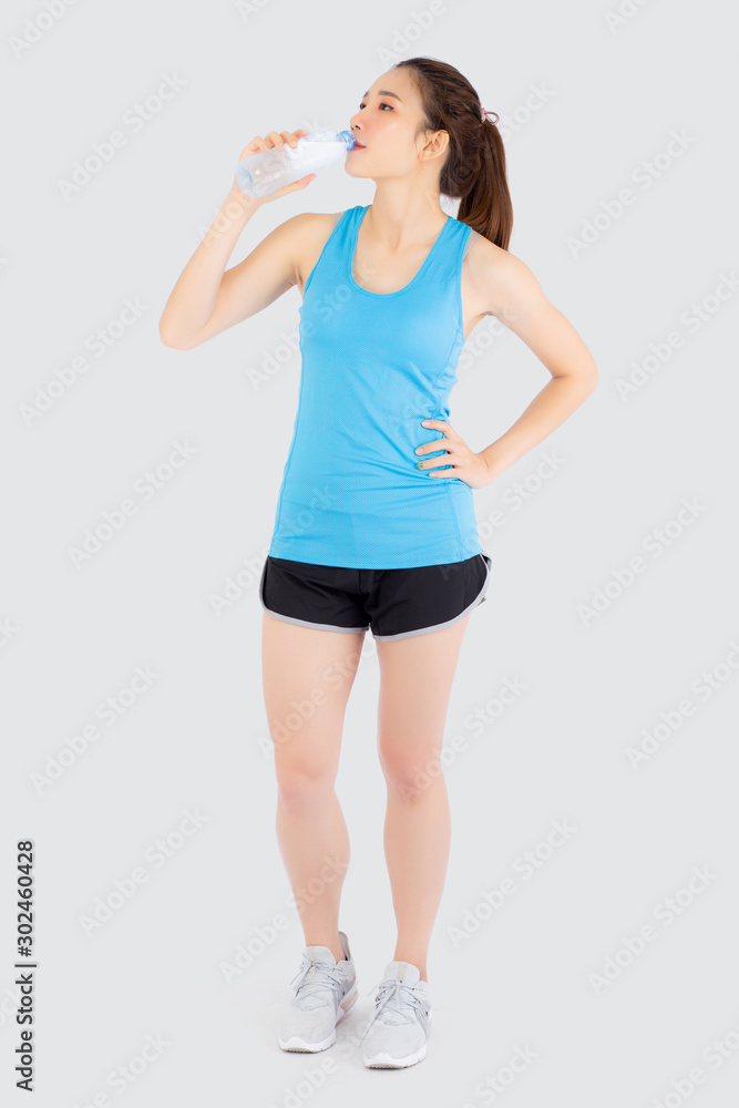 Beautiful young asian woman fit shape drinking water after workout and exercise isolated on white background, girl thirsty after aerobic tired for refresh, model fitness healthy and wellness concept. Beautiful young asian woman fit shape drinking water after workout and exercise isolated on white background, girl thirsty after aerobic tired for refresh, model fitness healthy and wellness concept.