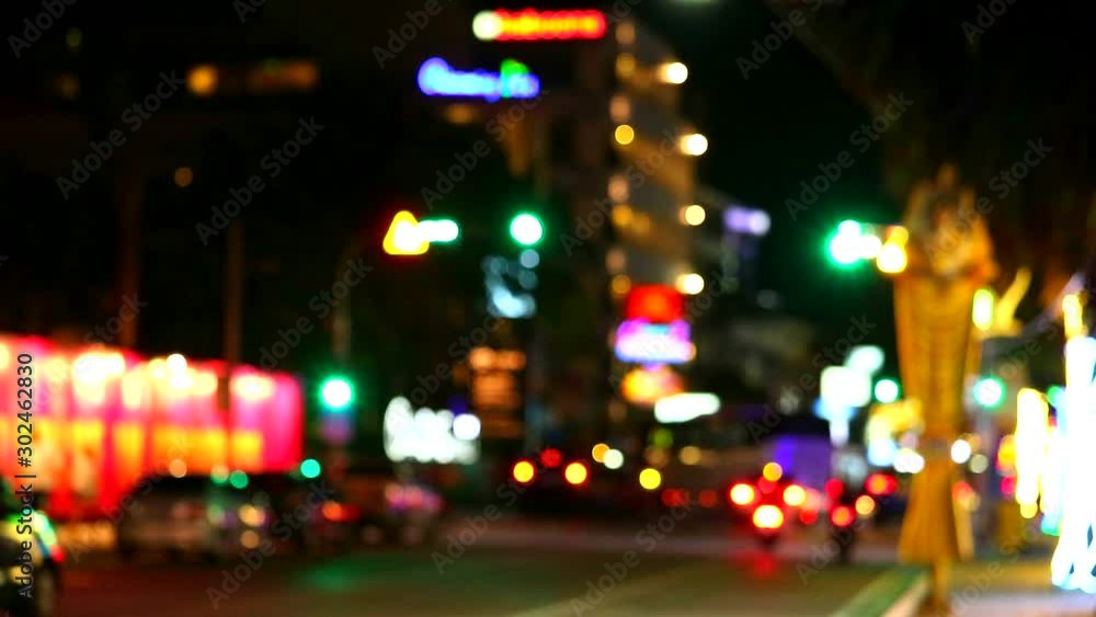 blur pattaya city and traffice light and transport on street and taxi service in night time blur pattaya city and traffice light and transport on street and taxi service in night time