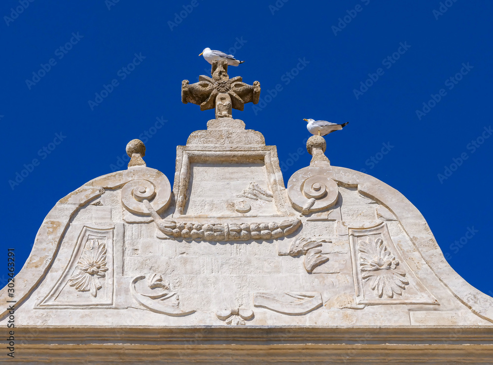 Picturesque baroque facade of house in the ancient town of Gallipoli, a beautiful travel destination in Puglia, Italy Picturesque baroque facade of house in the ancient town of Gallipoli, a beautiful travel destination in Puglia, Italy