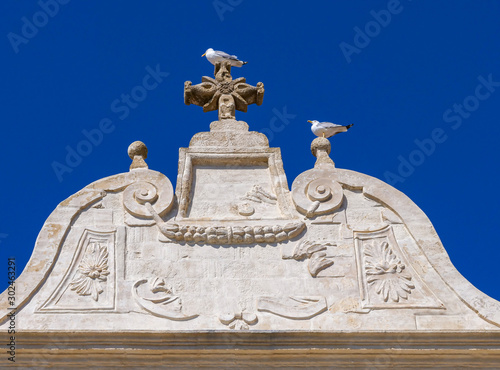 Picturesque baroque facade of house in the ancient town of Gallipoli, a beautiful travel destination in Puglia, Italy