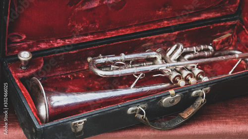 Silver trumpet in a red case © victorgrow