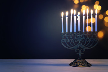 Religion image of jewish holiday Hanukkah background with menorah (traditional candelabra) and candles