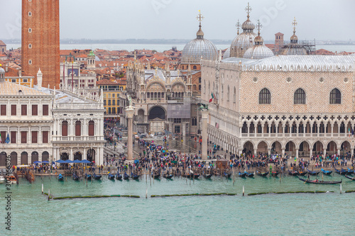 Aerial view of people and gondolas in San Marco square during high water, Venice, Italy
