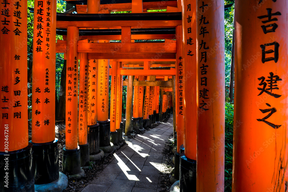 The iconic shrine in Kyoto, made famous for its thousands of orange and black torii gates which climb to the summit of Mt Inari The iconic shrine in Kyoto, made famous for its thousands of orange and black torii gates which climb to the summit of Mt Inari