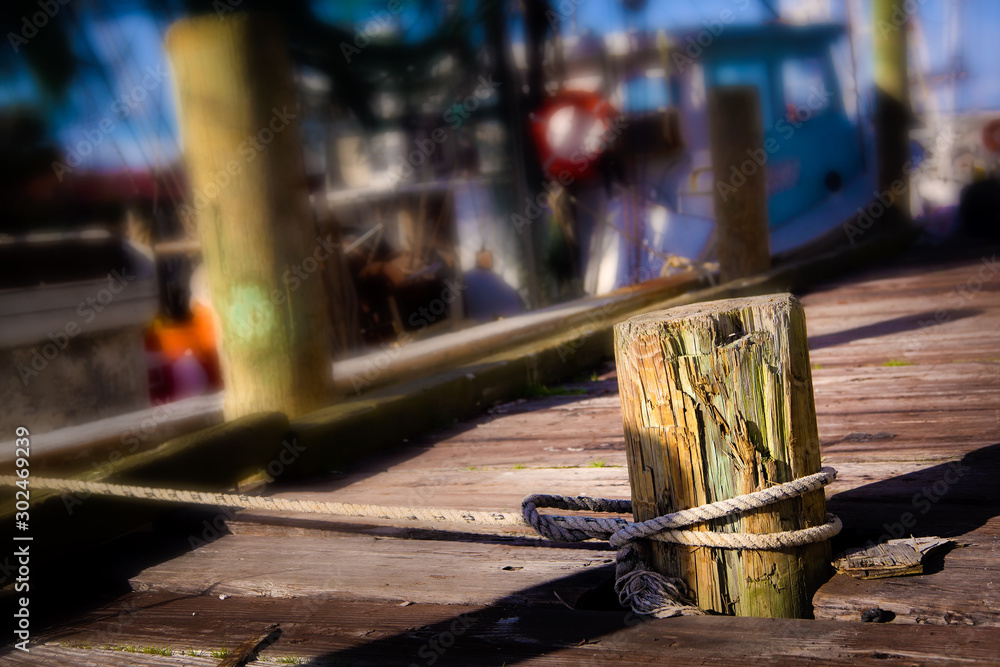 Rope tied to a piling for mooring Rope tied to a piling for mooring