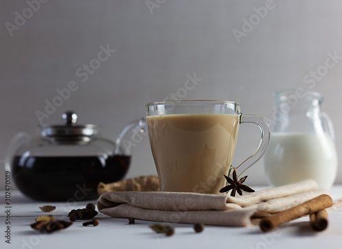 Flavoured masala Indian tea made by brewing black tea with milk, aromatic spices and herbs.
