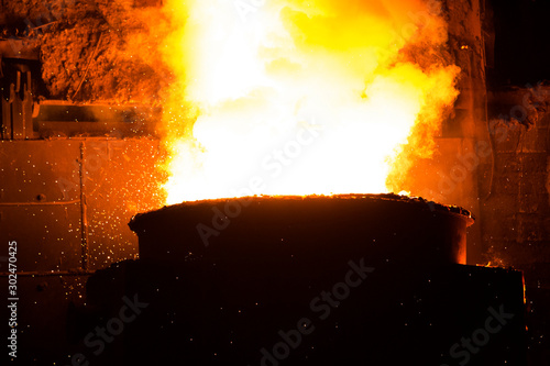 Heated metal pig gets squeezed and drilled at special metal forging unit at Brueck metal forging factory in Demra, Dhaka, Bangladesh. photo