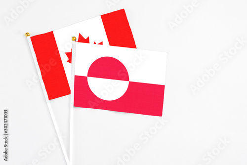 Greenland and Canada stick flags on white background. High quality fabric, miniature national flag. Peaceful global concept.White floor for copy space. Free Download Greenland and Canada stick flags on white background. High quality fabric, miniature national flag. Peaceful global concept.White floor for copy space. - GFXLoad