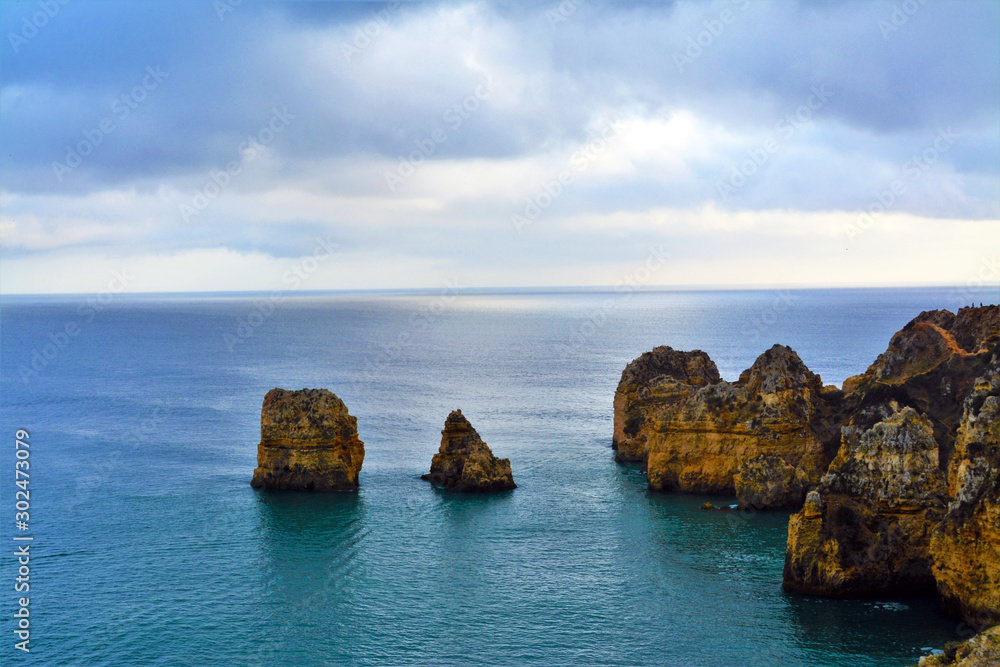 Naklejka premium Rocky beach in Lagos - Portugal on a cloudy day 31.Oct.2019