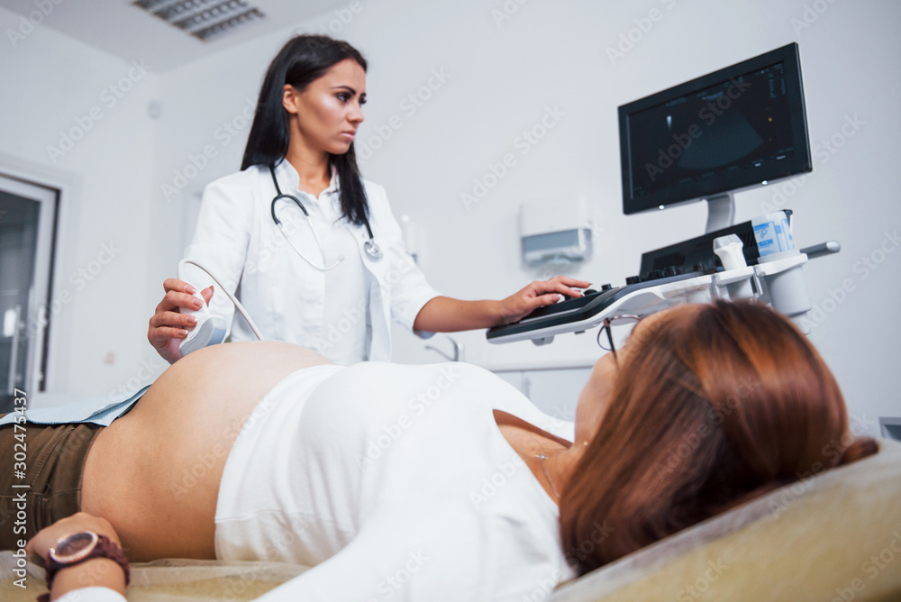 Doctor does ultrasound for a pregnant woman in the hospital Doctor does ultrasound for a pregnant woman in the hospital