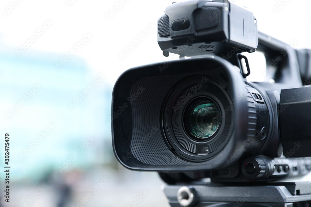 Professional video camera on city street, closeup