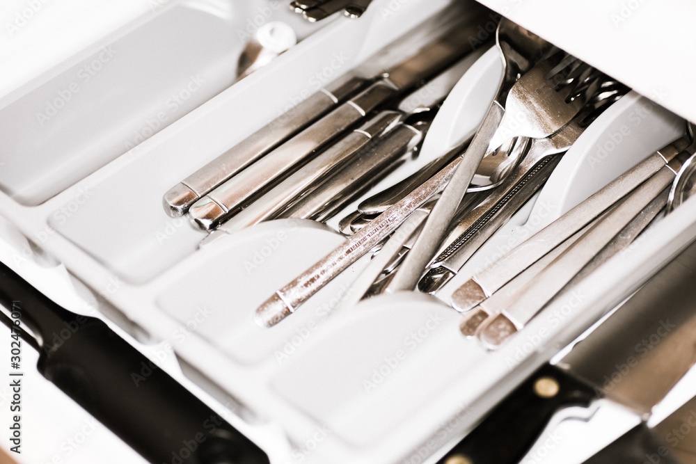 Old messy cutlery drawer in the kitchen Old messy cutlery drawer in the kitchen