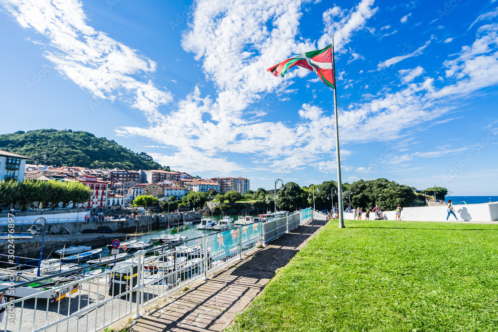 Naklejka premium MUNDACA, SPAIN - 12 AUGUST,2017: this town is located in the coast at the mouth of the Urdaibai Ria in the Bay of Biscay