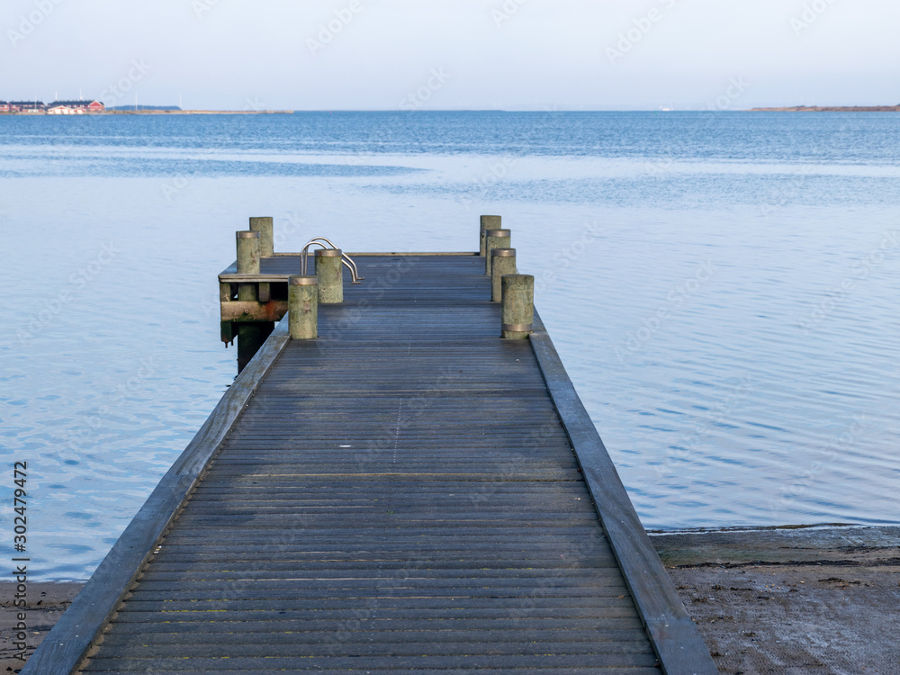 landscape with wooden footbridge on the coast