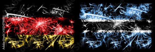 Germany, German vs Botswana, Botswanan New Year celebration travel sparkling fireworks flags concept background. Combination of two abstract states flags. © Vlad