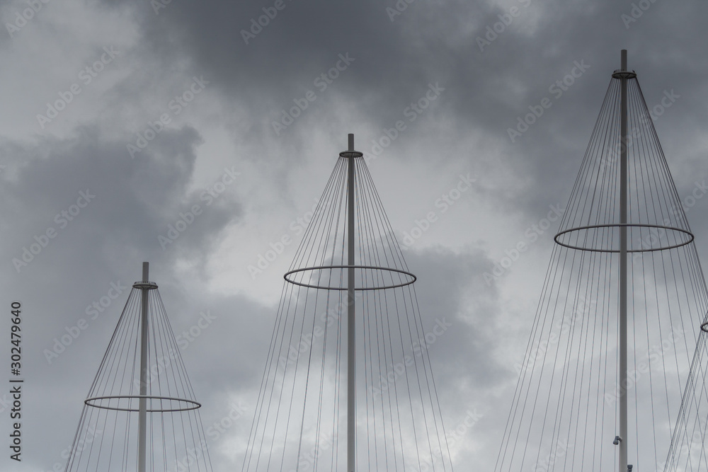 Obraz premium Masts of The Circle Bridge, a pedestrian bridge spanning the southern mouth of Christianshavn Canal in the Christianshavn area of central Copenhagen, Denmark.