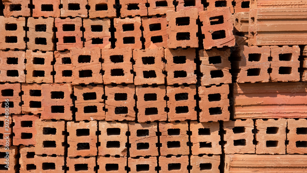 Pile of red clay building bricks background in construction area . Pile of red clay building bricks background in construction area .