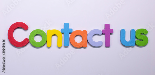 "Contact us" written with color sponge