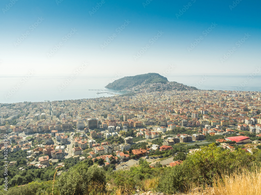 Alanya, Turkey. Beautiful panoramic top view of the city of Alanya and the Mediterranean Sea from the mountain. Vacation postcard background