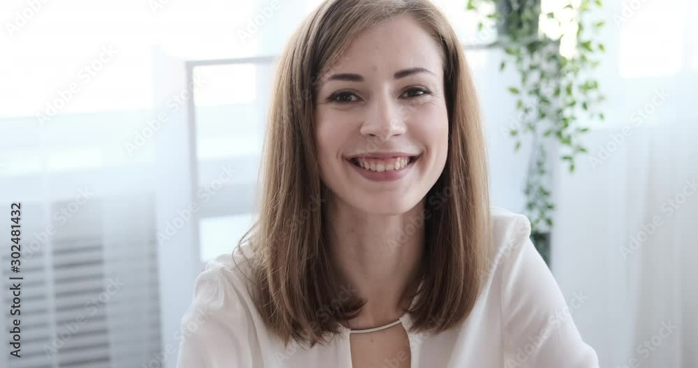 Portrait of smiling businesswoman working on office laptop Portrait of smiling businesswoman working on office laptop