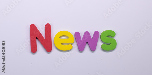 Word News written with color sponge