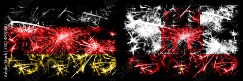 Germany, German vs Gibraltar New Year celebration travel sparkling fireworks flags concept background. Combination of two abstract states flags. © Vlad