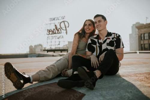 young couple sitting on a bench