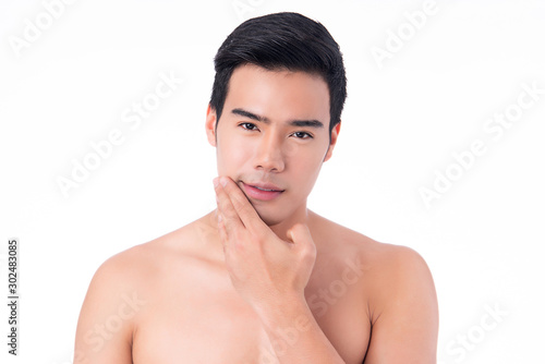 Portrait of Handsome young asian man isolated on white background. Concept of men's health and beauty, self-care, body and skin care.