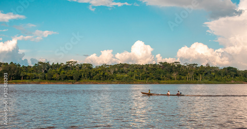 recorrido en rio amazonas a orillas de la selva amazonica de peru en un casi atardecer  photo