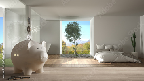 Obraz na płótnie Wooden table top or shelf with white piggy bank with coins, modern panoramic bed