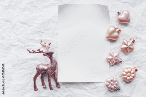 Creative composition with Cerulean deer and Christmas decorations in pastel colors. Flat lay, minimalism. photo