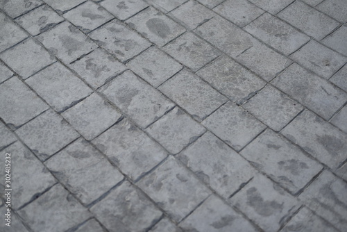 cobblestone concrete stamp's pattern texture detail in walking street with close up detail