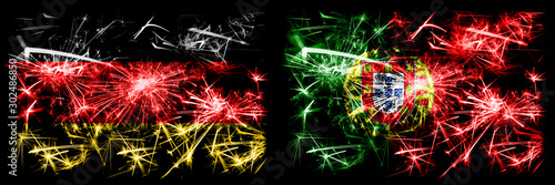 Germany, German vs Portugal, Portuguese New Year celebration travel sparkling fireworks flags concept background. Combination of two abstract states flags.