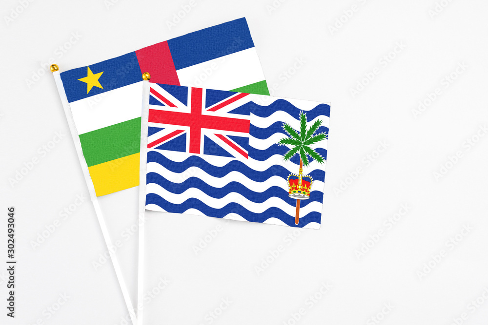 Fototapeta premium British Indian Ocean Territory and Central African Republic stick flags on white background. High quality fabric, miniature national flag. Peaceful global concept.White floor for copy space.