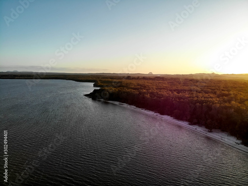 Fototapeta Naklejka Na Ścianę i Meble -  Aerial view of Boreen point lagoon and forest at sunrise