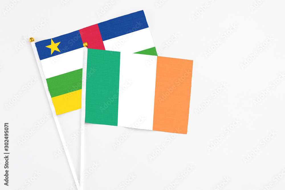 Ireland and Central African Republic stick flags on white background. High quality fabric, miniature national flag. Peaceful global concept.White floor for copy space. Ireland and Central African Republic stick flags on white background. High quality fabric, miniature national flag. Peaceful global concept.White floor for copy space.