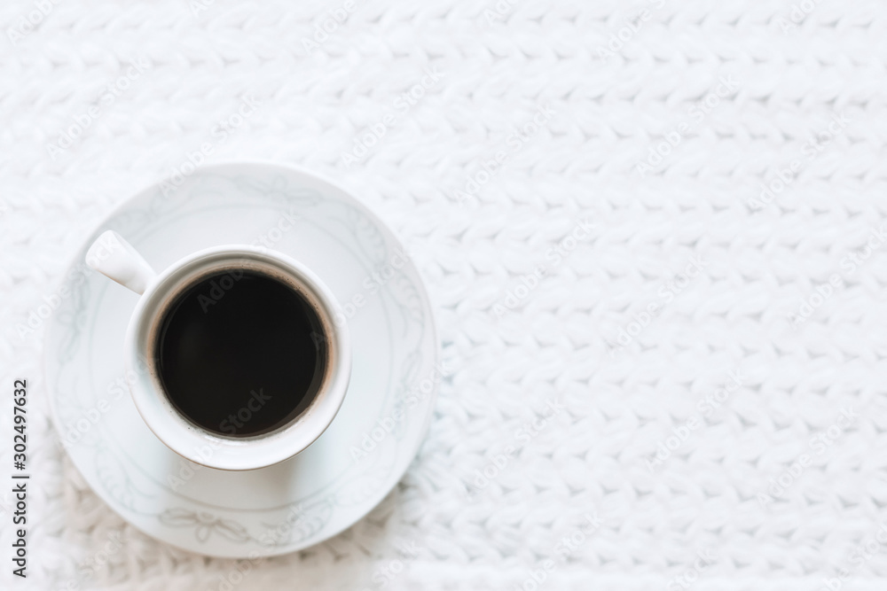 Morning coffee. A cup of coffee. Hot black coffee on the pure white knitted tablecloth Morning coffee. A cup of coffee. Hot black coffee on the pure white knitted tablecloth