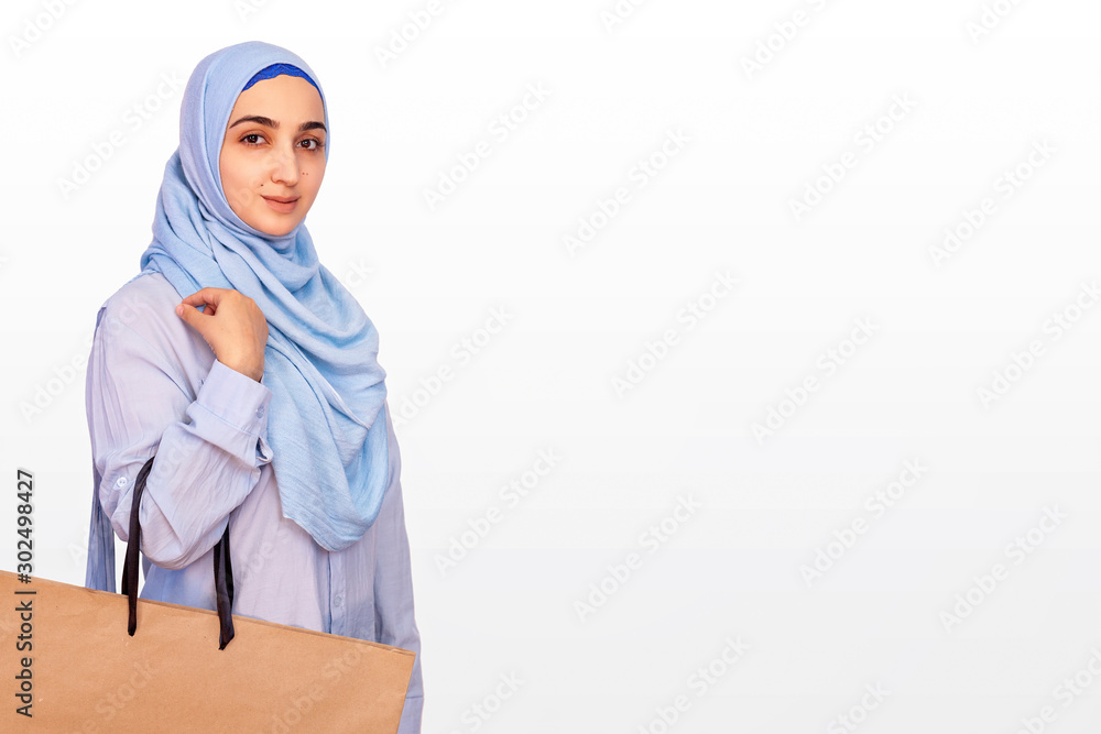 Cute muslim woman with shopping bag