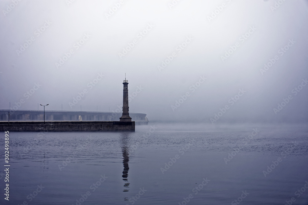 Lighthouse on the Dnieper River on a foggy day.