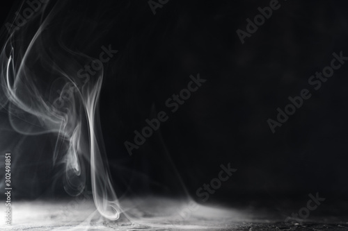 Tablou pe pânză Smoke on dark background with copyspace