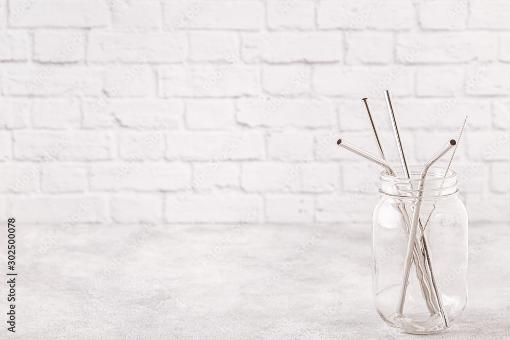 Reusable metal drinking sraws and cleaning brush in a jar. Reusable metal drinking sraws and cleaning brush in a jar.