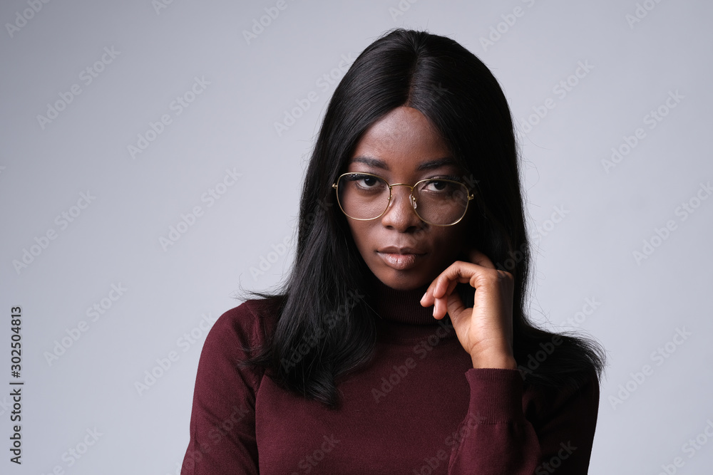 Confident african model looking very intelligent in eyeglasses. Confident african model looking very intelligent in eyeglasses.