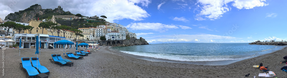 background panoramic view of the coast and the beach of the city of Amalfi, Amalfi coast, Italy, Europe