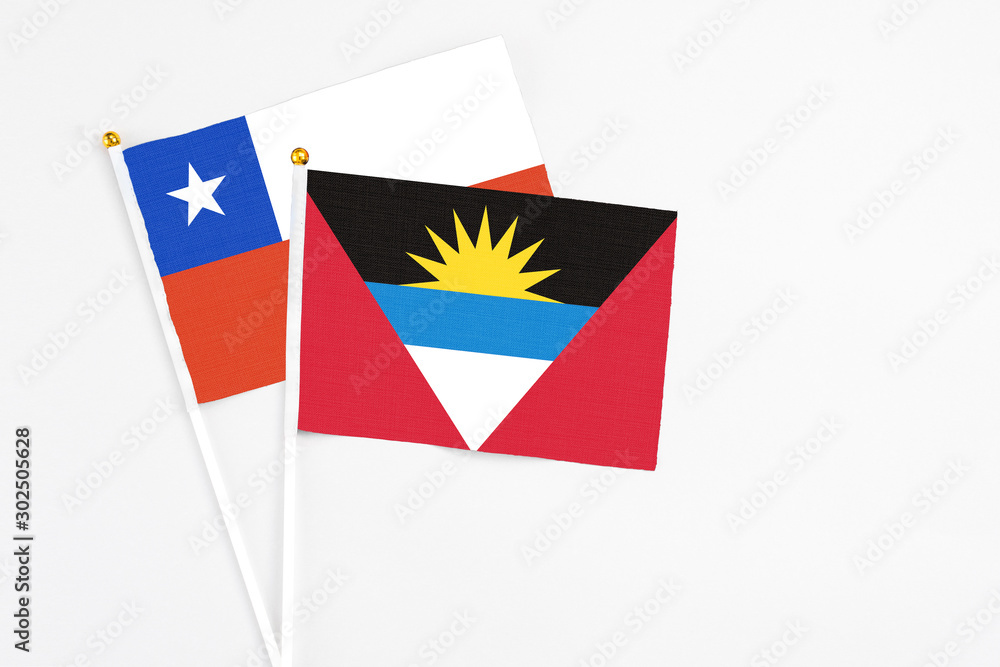 Antigua and Barbuda and Chile stick flags on white background. High quality fabric, miniature national flag. Peaceful global concept.White floor for copy space. Antigua and Barbuda and Chile stick flags on white background. High quality fabric, miniature national flag. Peaceful global concept.White floor for copy space.