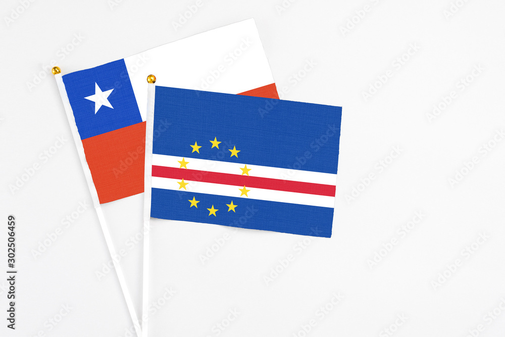 Cape Verde and Chile stick flags on white background. High quality fabric, miniature national flag. Peaceful global concept.White floor for copy space. Cape Verde and Chile stick flags on white background. High quality fabric, miniature national flag. Peaceful global concept.White floor for copy space.