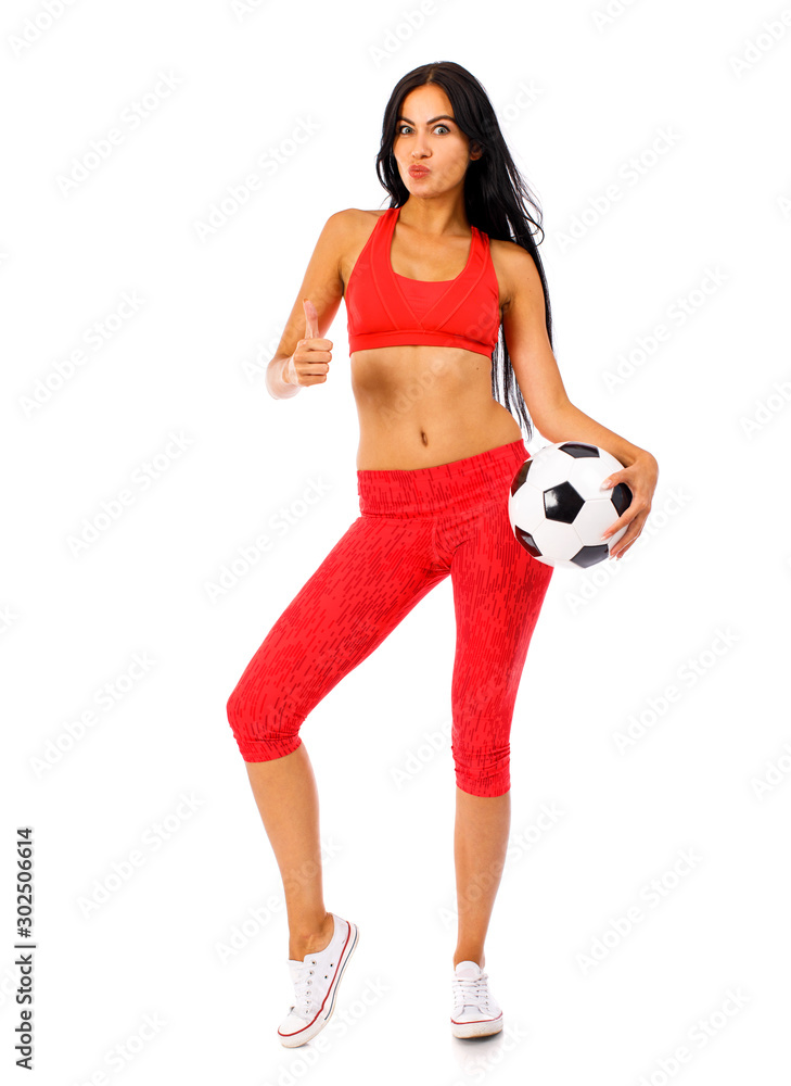 Fitness woman in a red sports suit with soccer balls Fitness woman in a red sports suit with soccer balls