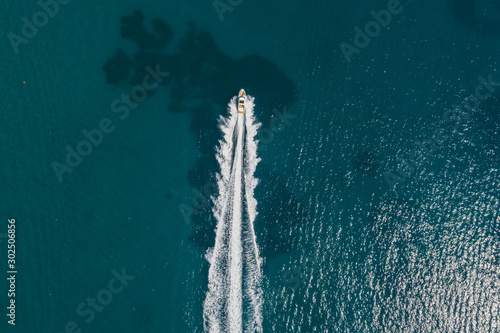 Aerial view of small boat flowing in Mediterranean sea, travel and vacation concept © Viachaslau